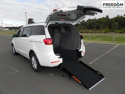 Kia Carnival YP wheelchair vehicle - Rea angle view with ramp down